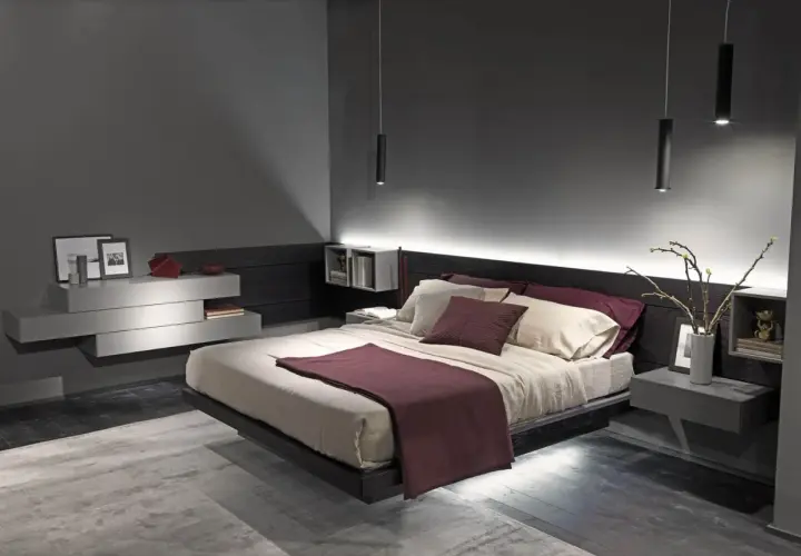 Camera da letto moderna con letto sospeso, luci soffuse e arredi minimalisti. Un vero regno del relax, la "camera queen" perfetta.
