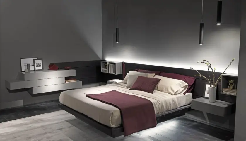 Camera da letto moderna con letto sospeso, luci soffuse e arredi minimalisti. Un vero regno del relax, la "camera queen" perfetta.