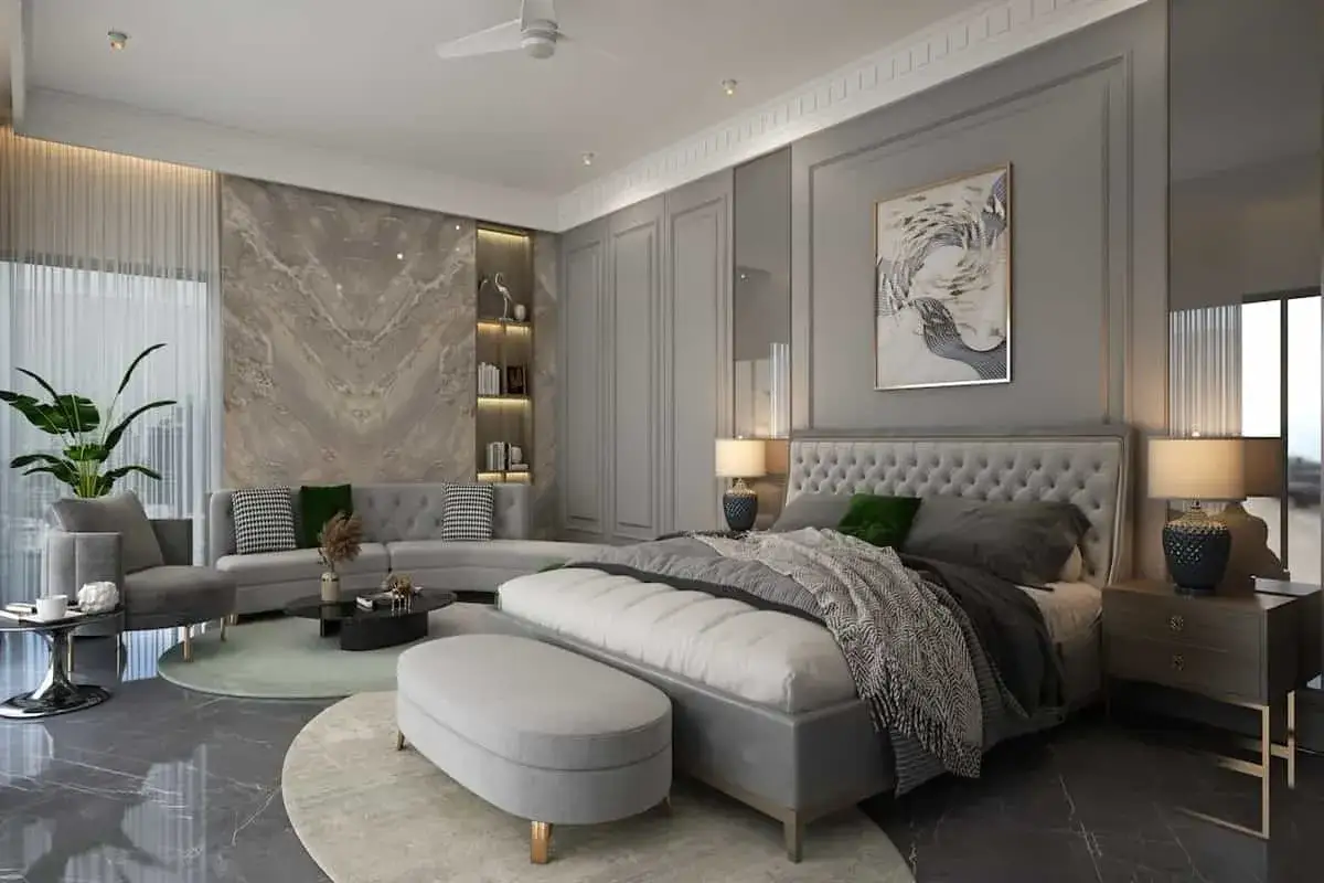 Elegante suite con letto king-size, divano, tavolino e lampade. Come si scrive suite? In questo ambiente da sogno, ogni dettaglio è curato.